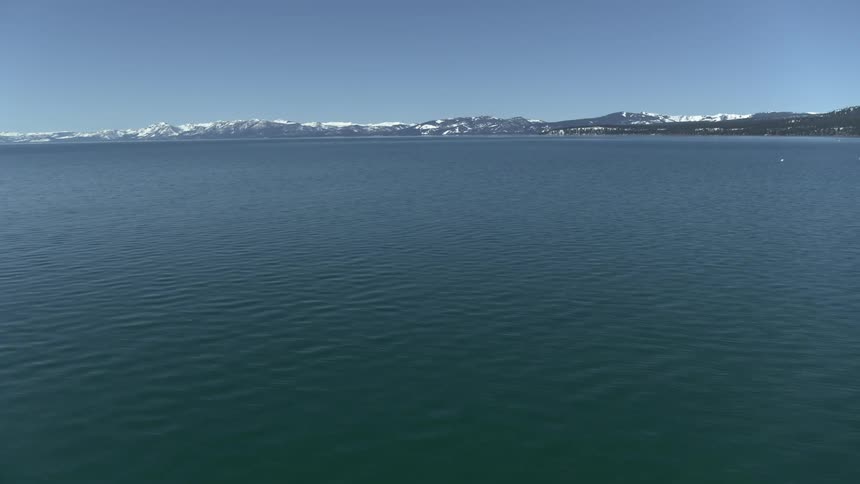 There is mountains covered in snow in the horizon
