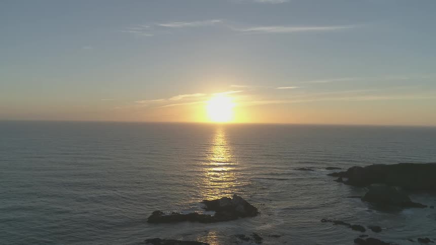 The sun shines onto the ocean surface