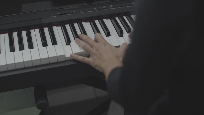Family Playing Old Piano In House