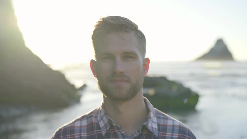 A man standing at the edge of a coast