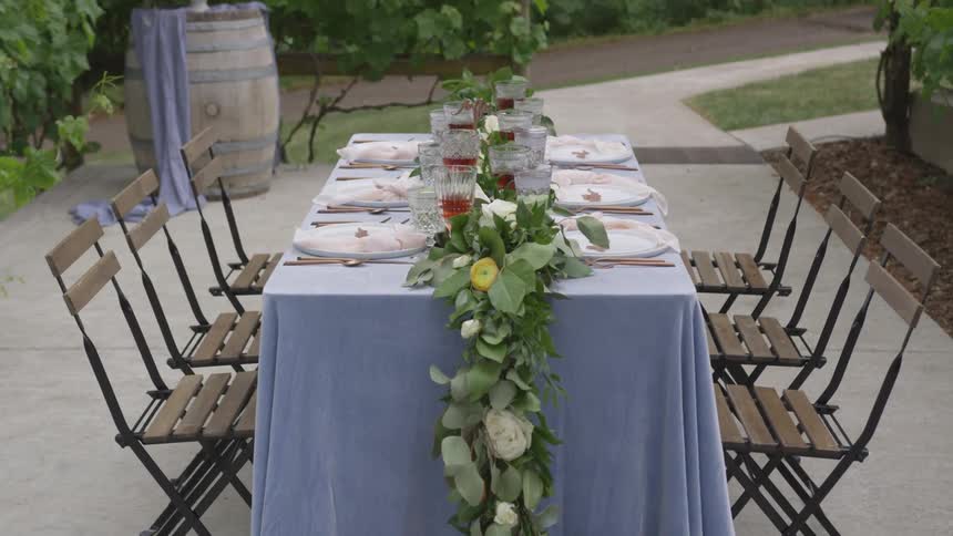 A table that is set outdoors in a yard