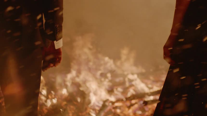 Couple Kissing By Fire In Desert