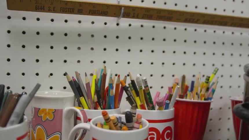 Mugs of different writing materials