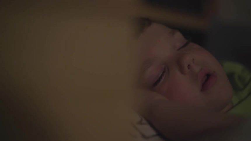 A child sleeping on someone's arm