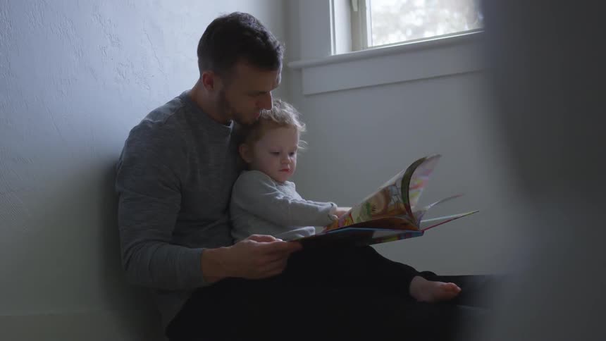 Father And Daughter Playing At Home
