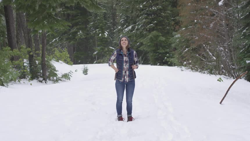 A woman standing in the snow