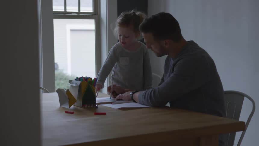 Father And Daughter Playing At Home