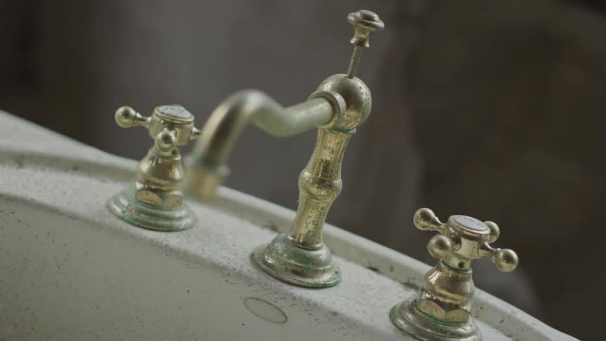 An old faucet on a sink