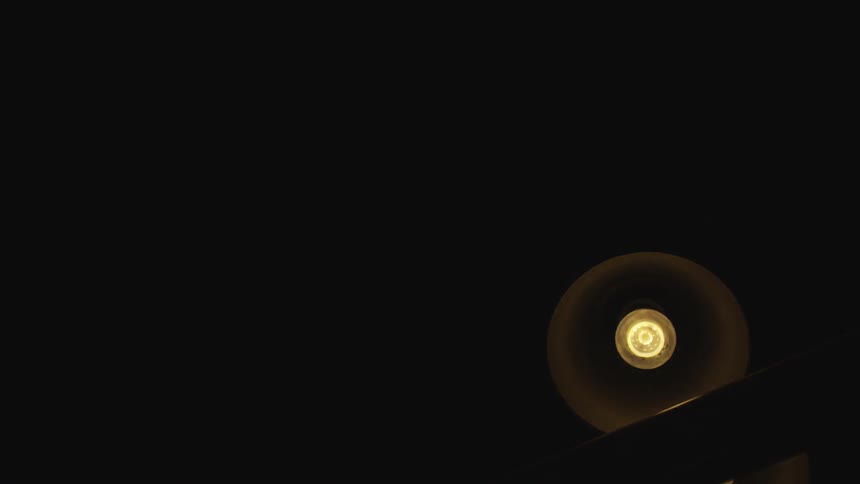 Light turning off an on perhaps in slow motion and then turning off completely inside an indoors room