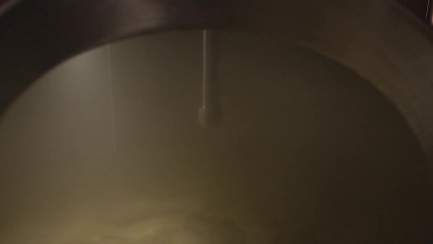 The dark pot is full of boiling liquid