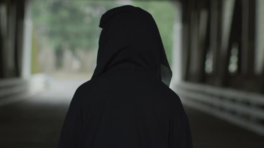 Hooded Figure On Bridge