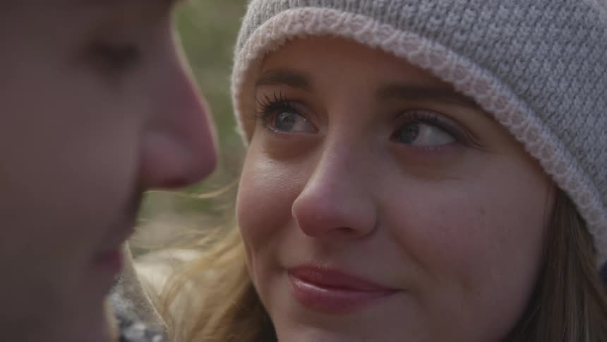 A woman looking at a man