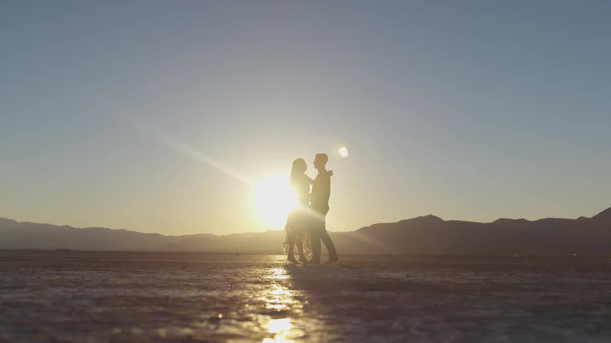 Couple embrace in the desert