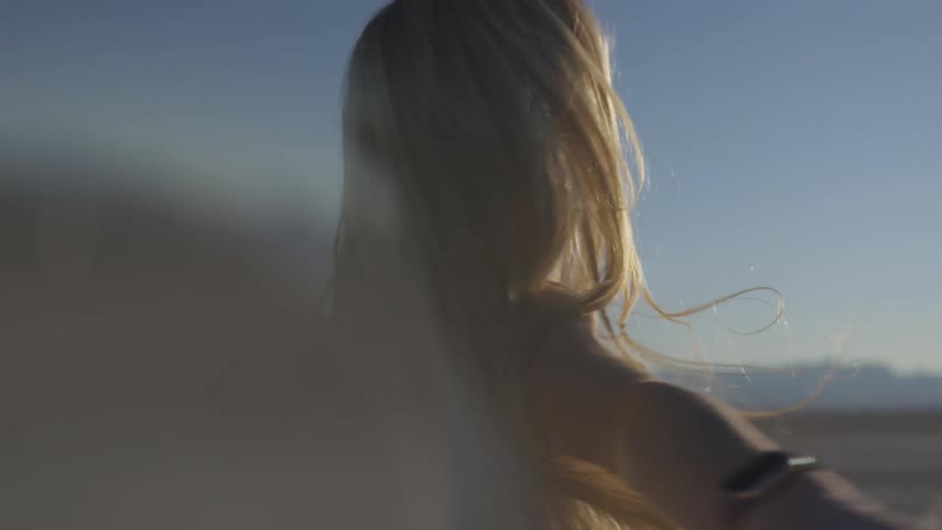 Woman dancing in a sunny field