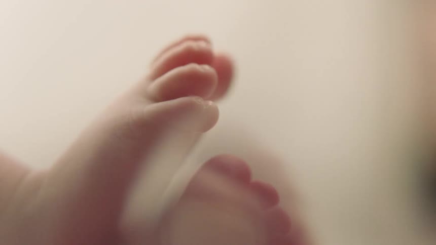A baby is moving its feet