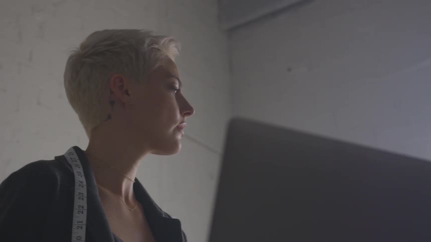 Woman with short hair working at computer