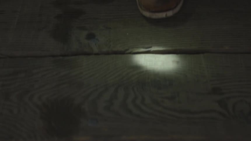 Someone walks on a wooden floor
