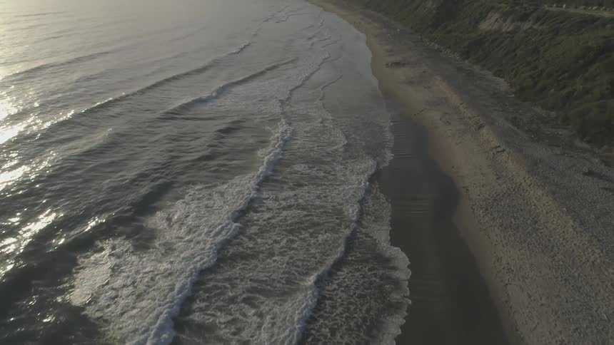 Waves in the ocean flow onto a beach