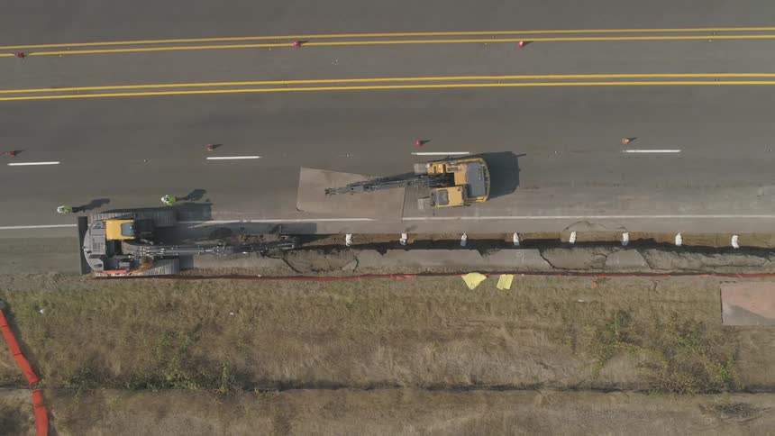 A large construction vehicle on the highway