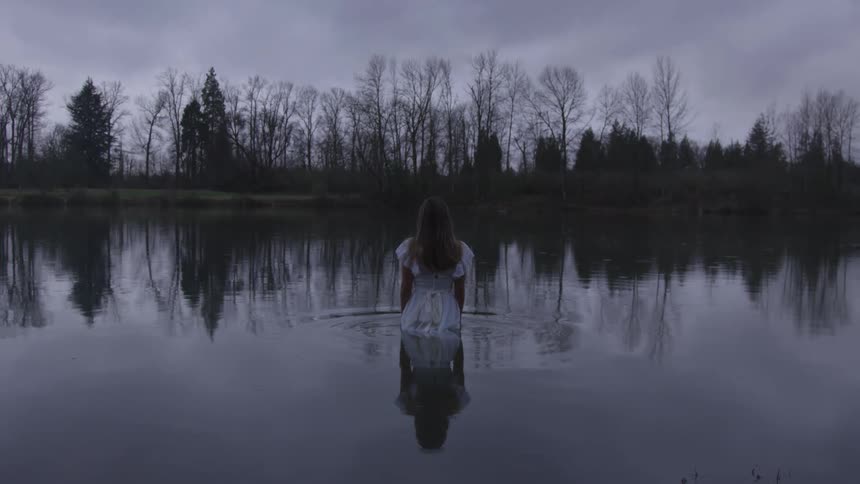 Girl Wading In Pond