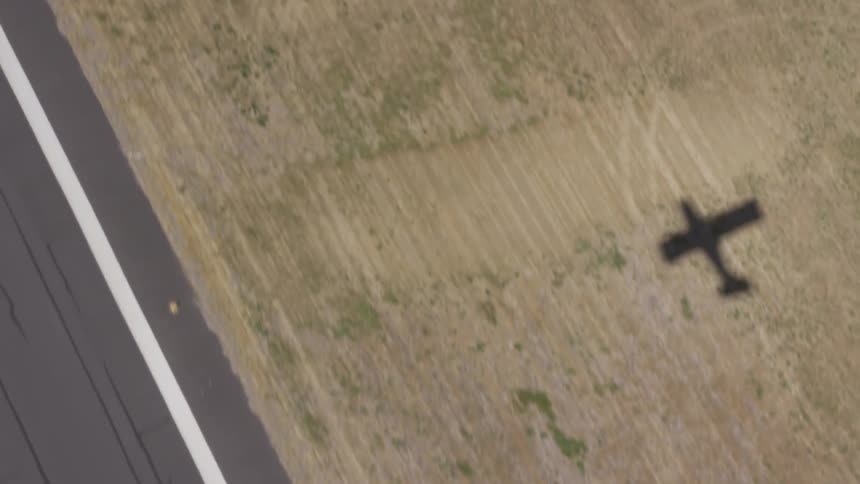 There is a shadow of an airplane