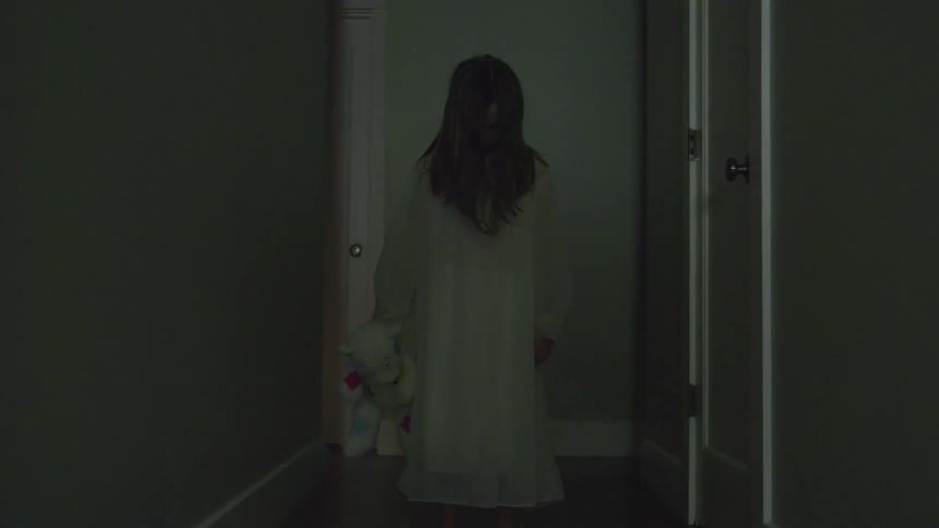 A girl is holding a stuffed animal