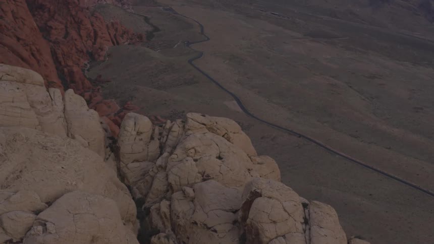 Rocky terrain and a stream can be seen from an aerial view