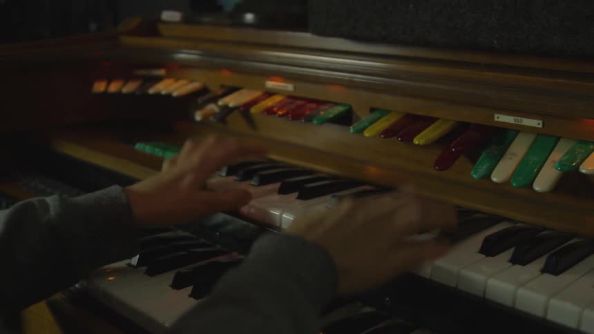 Man plays a piano