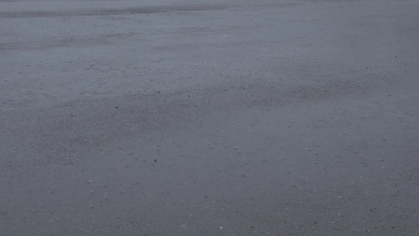 Rain falls on the ground during a storm