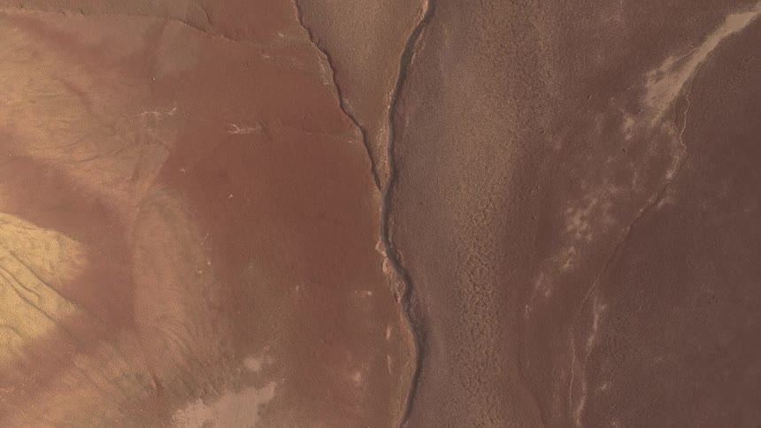 Dry and cracked flat desert land