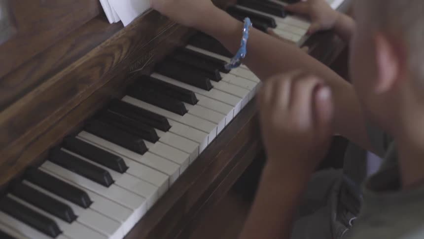 Family Playing Old Piano In House
