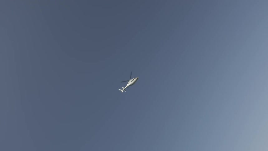 Helicopter in an empty blue sky