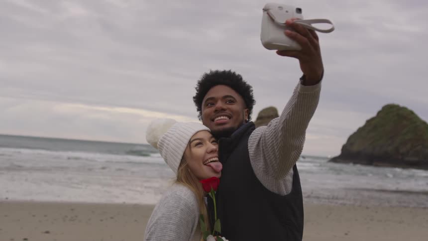 A man and woman take a photo together