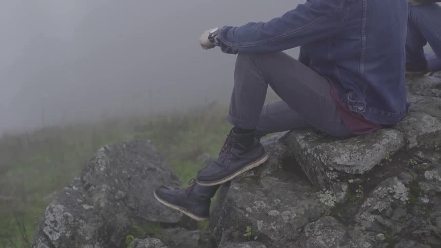 Friends Hiking In Foggy Forest