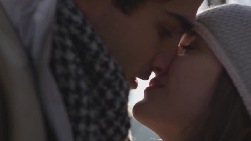 A man and a woman kissing