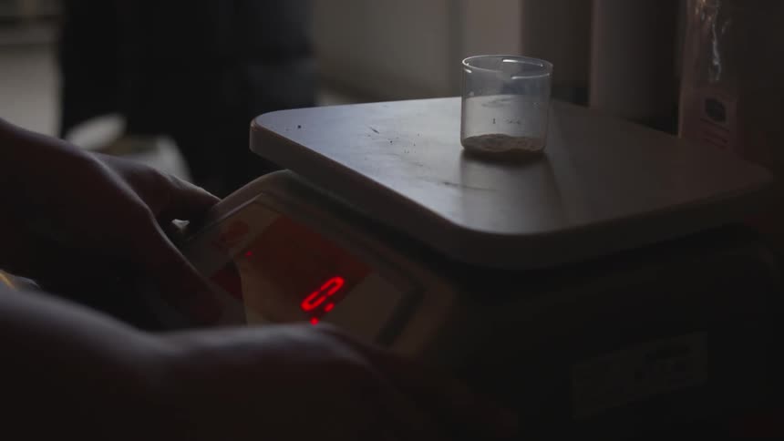 Using a gram scale to measure something in a small container