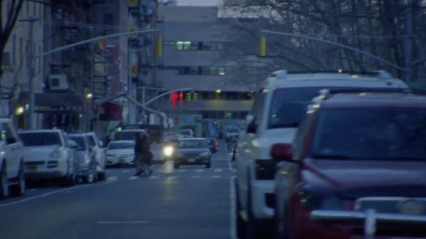 Parked cars on a busy city street