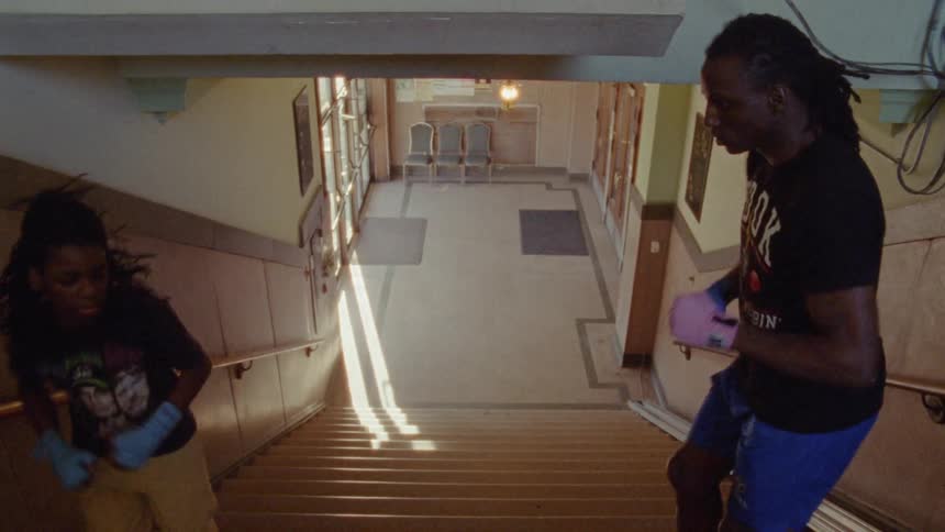 Two young people climbing and descending the stairs for exercise