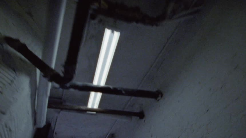 A tunnel ceiling opens up into the outdoors