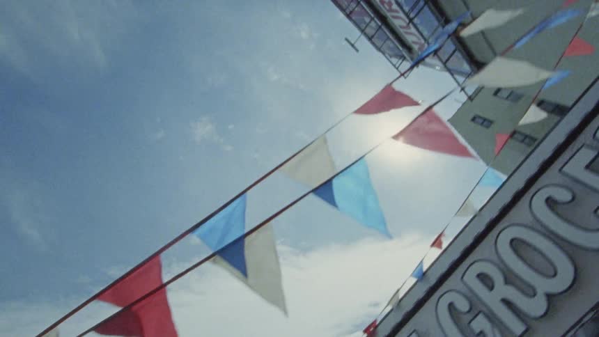 Streamers flow in the wind above a building