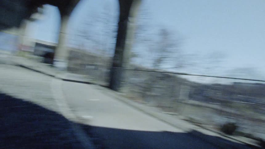Under a bridge in a city