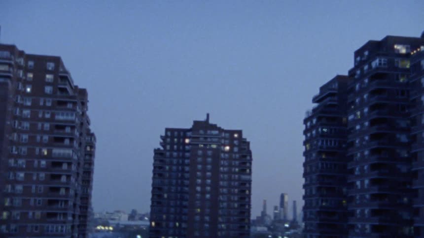 The tall apartment buildings fill the busy city
