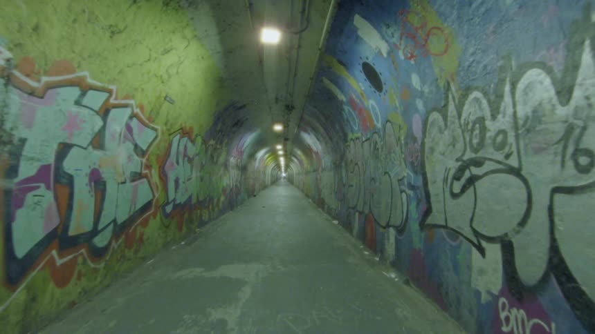 Long graffiti lined tunnel