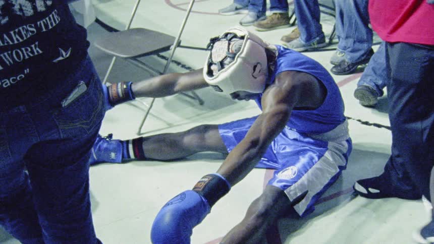 A young boxer prepares to face his opponent