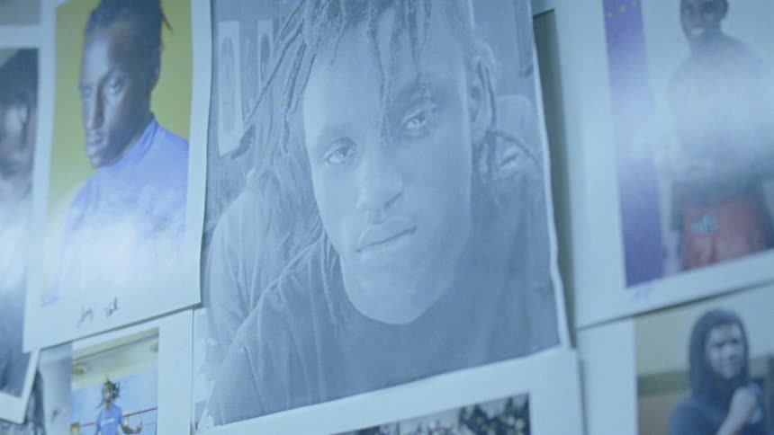 Photographs of a man hanging on a wall