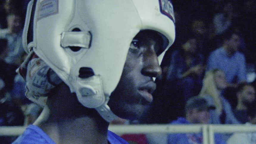 A man is wearing a white helmet