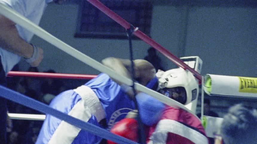 A boxer hits another boxer multiple times
