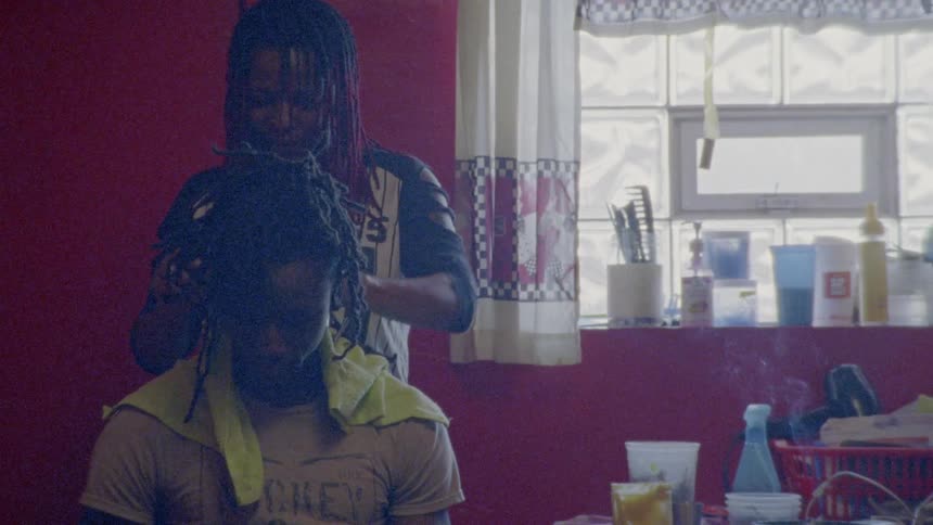 Woman cutting a man's hair