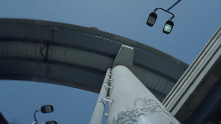 The pillar holding up the overpass is covered in graffiti
