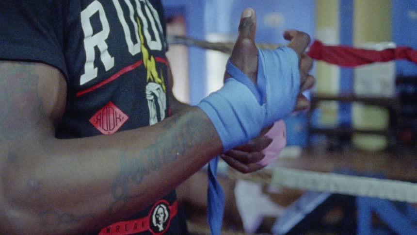 A man prepares to fight on a boxing ring